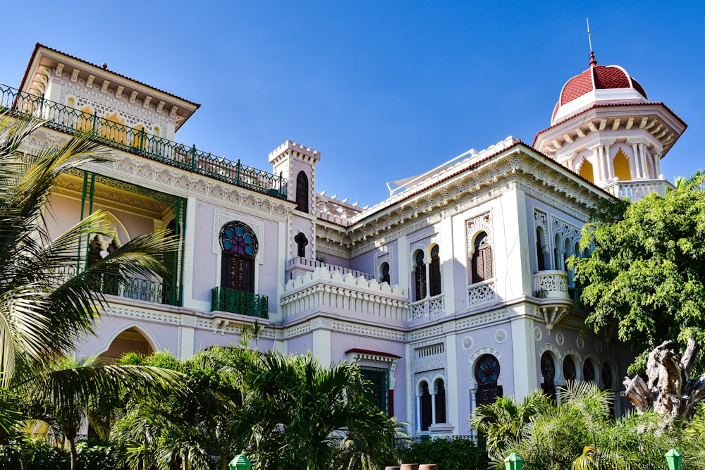 a large white building with a red roof