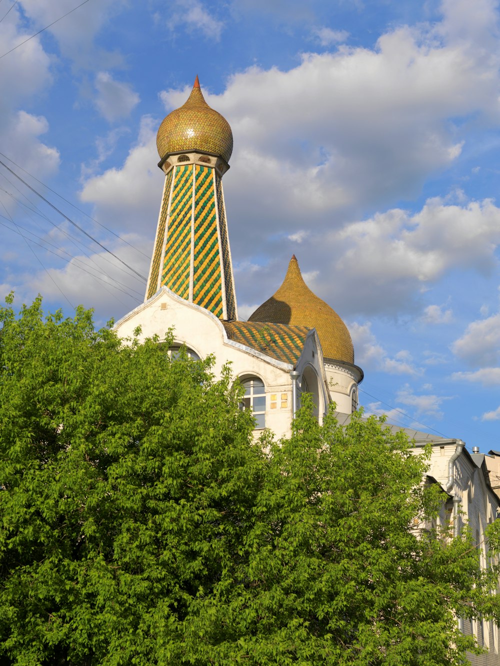 a tall building with a golden dome on top of it