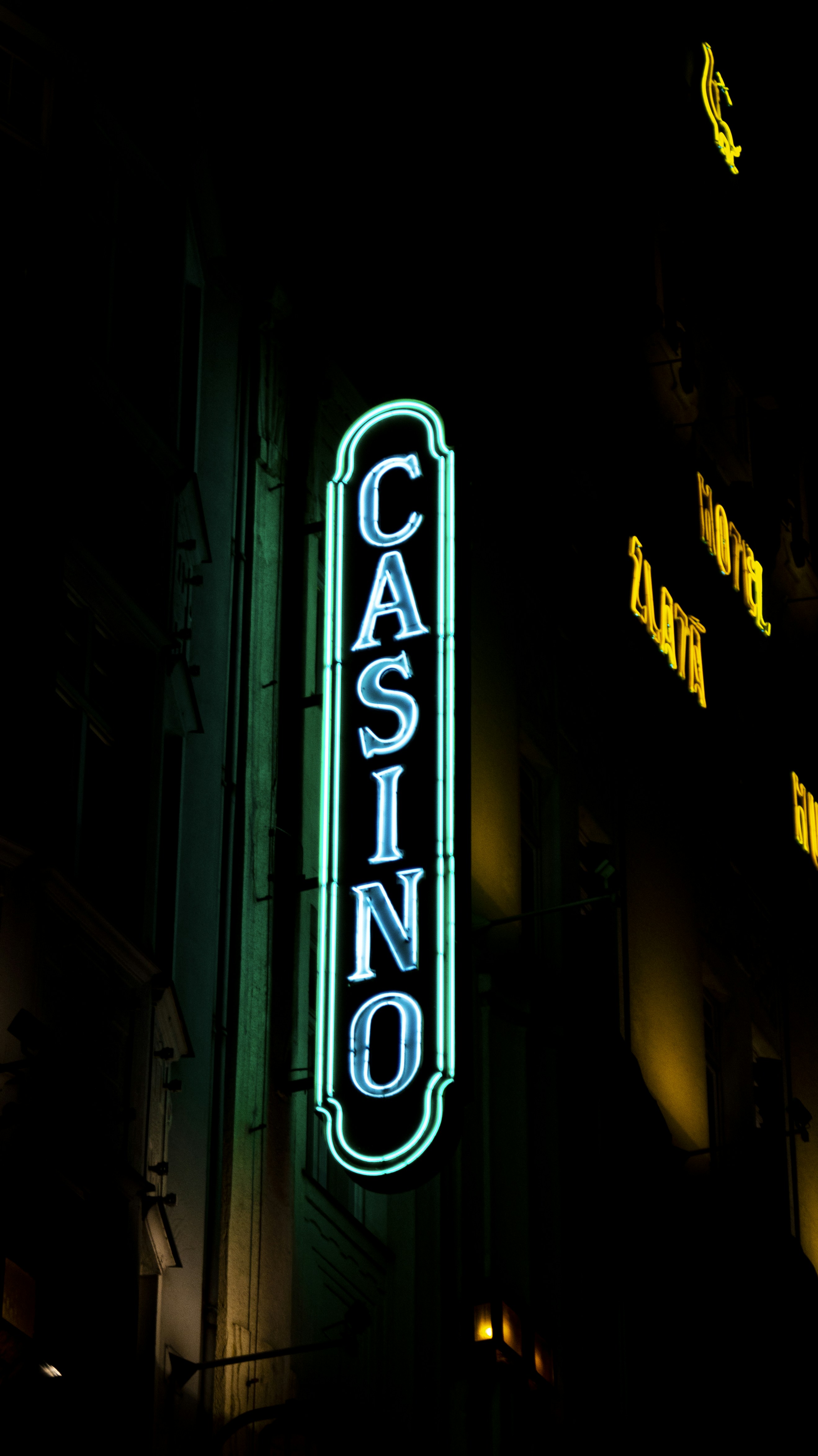 a neon sign on the side of a building
