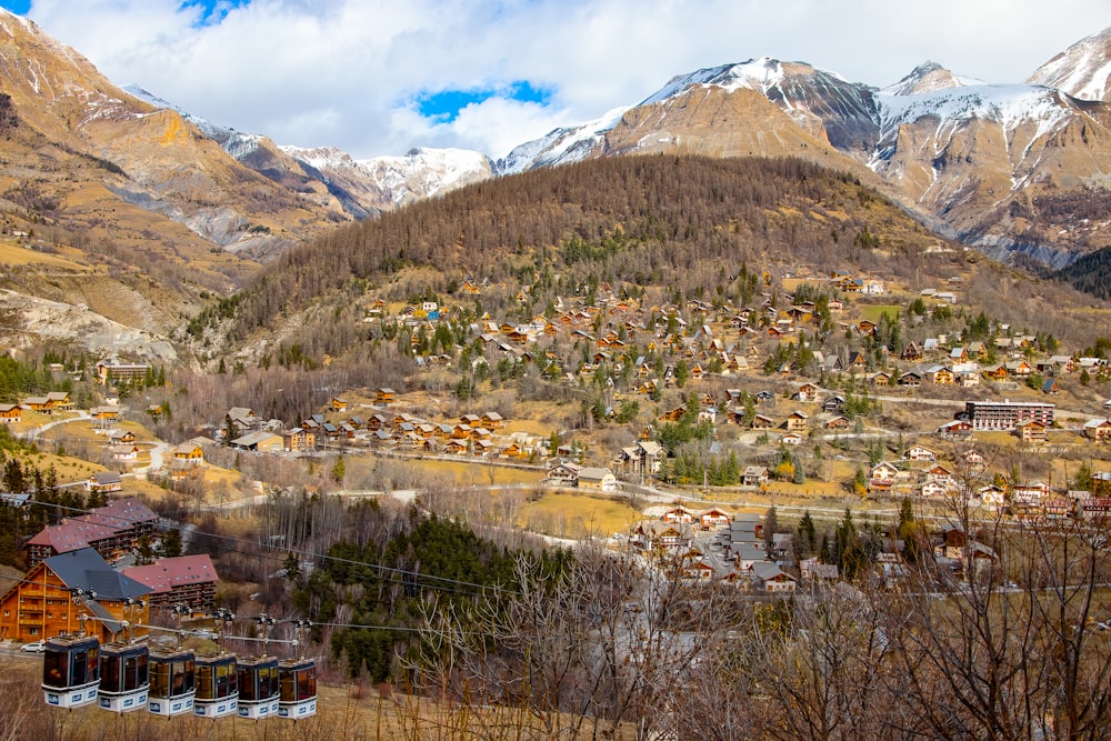 a village nestled in the mountains surrounded by trees
