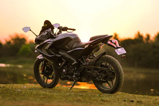 An elegant scene where Alex motorcycles sit beside a golf course, blending speed and leisure in Miami's golden hour.