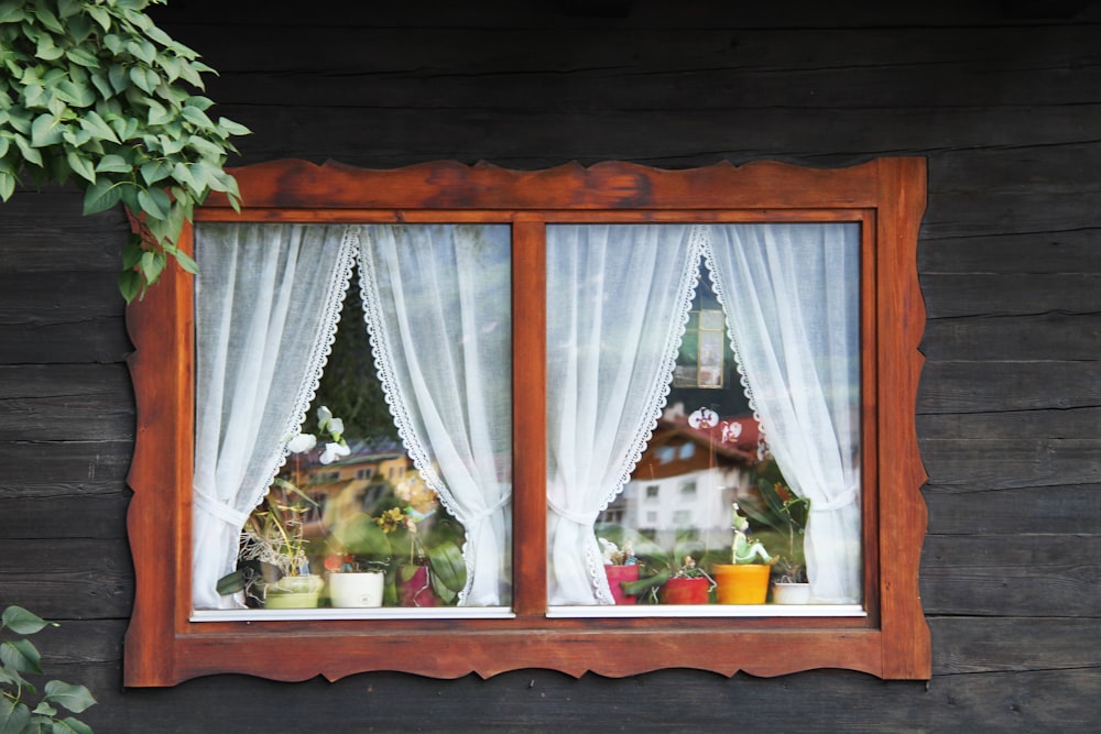 a picture of a window with a view of a building