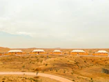 Spacious labor accommodation cabins arranged neatly in a desert environment