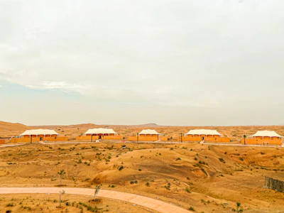 Spacious labor accommodation cabins arranged neatly in a desert environment