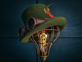 a green hat with a light bulb attached to it