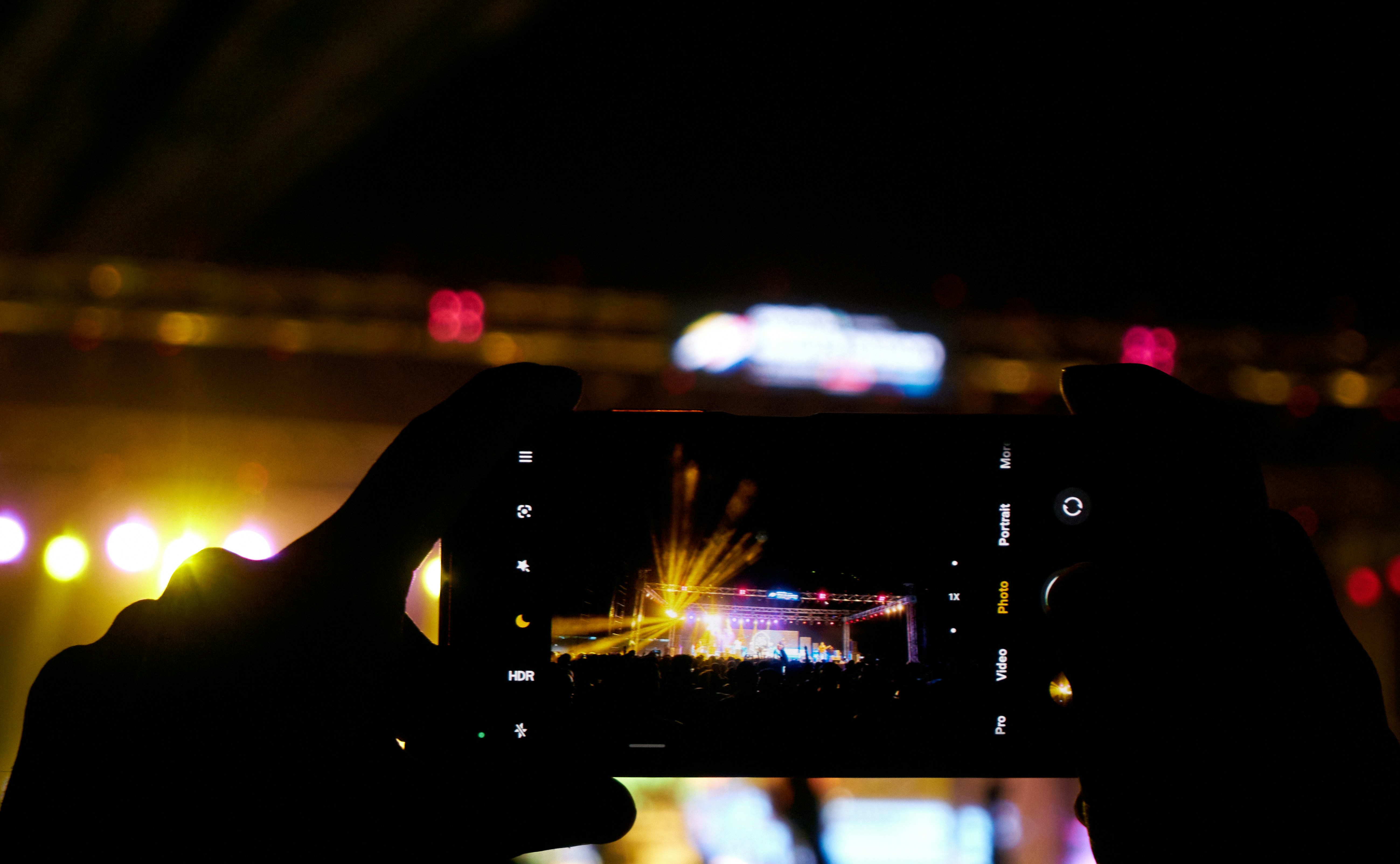 Elan & ηVision 23: Catching the moment-festival lights framed on a phone screen