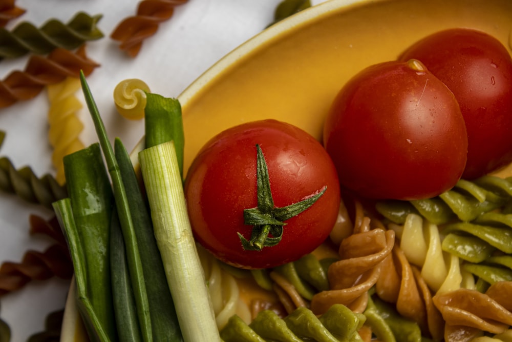 a yellow plate topped with green beans and tomatoes