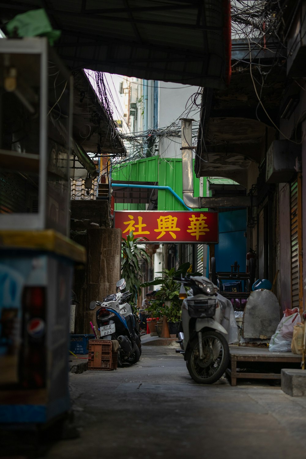a motorcycle parked in a narrow alley way
