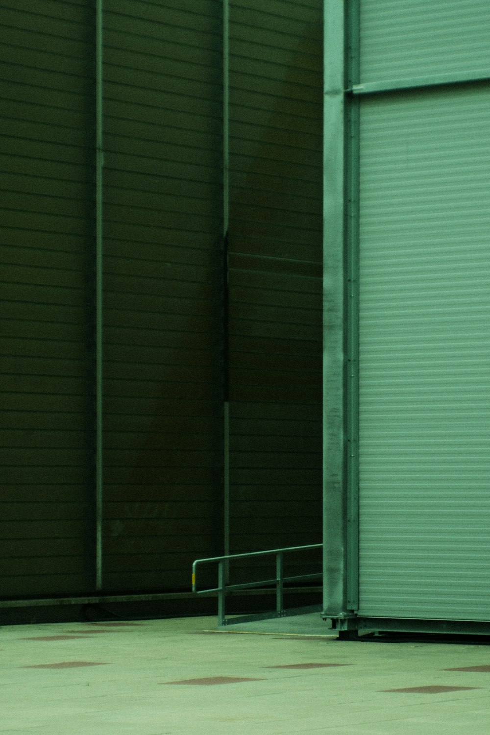 a man riding a skateboard down a metal hand rail