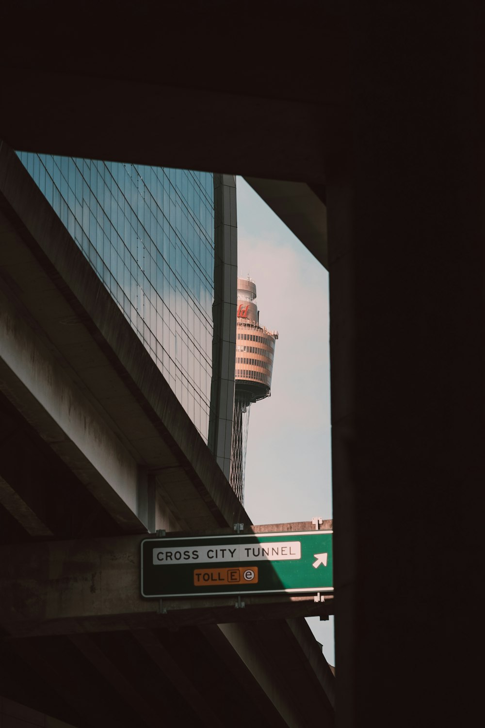 a view of a bridge with a tower in the background