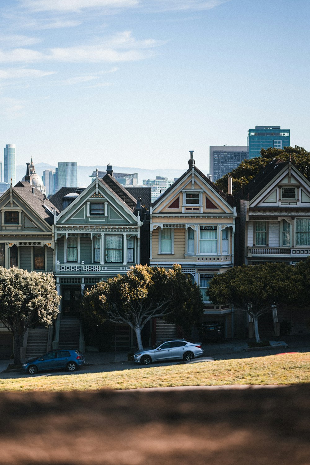 a row of houses with a car parked in front of them