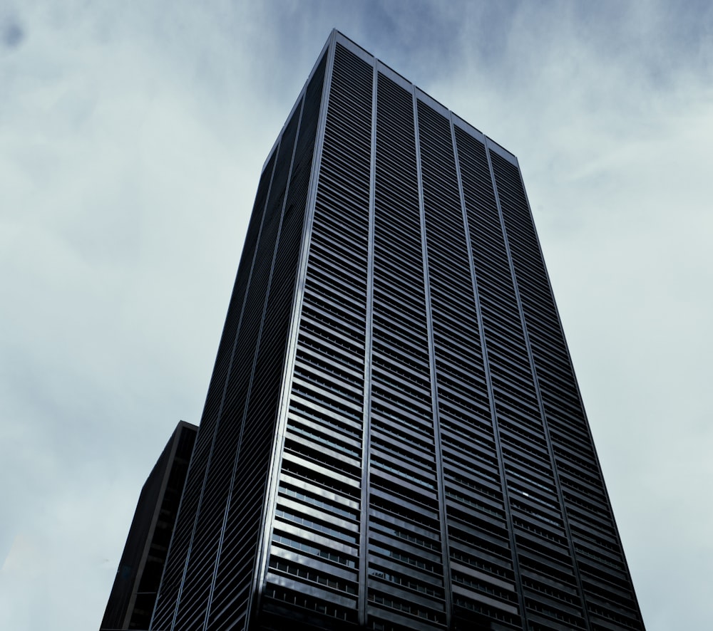 a very tall building with a sky background