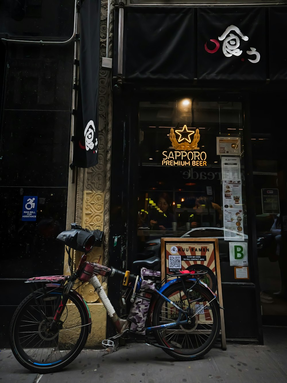 a bicycle is parked outside of a restaurant