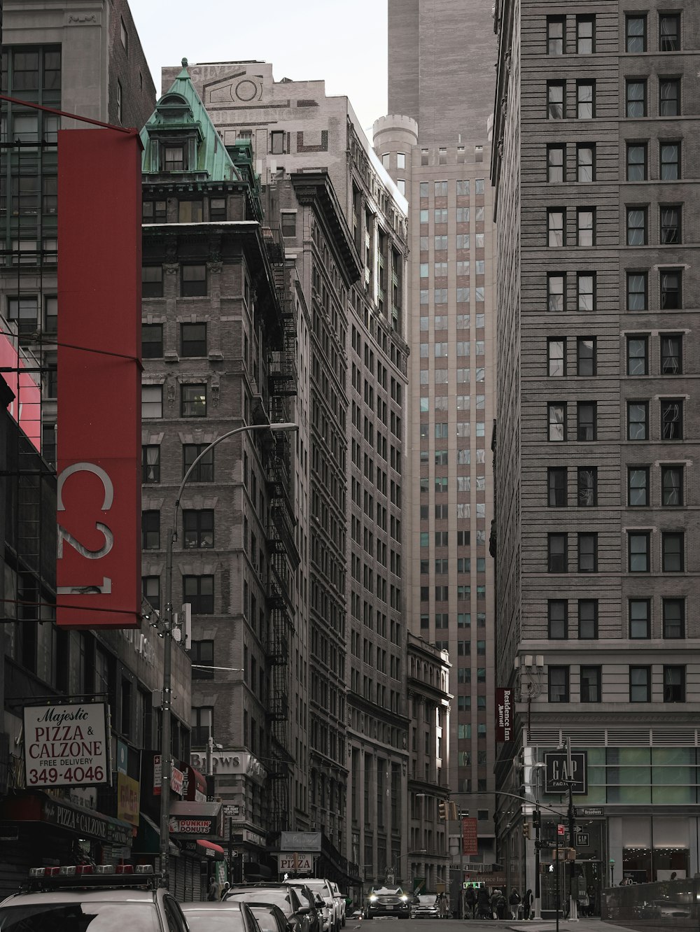 a city street filled with lots of tall buildings