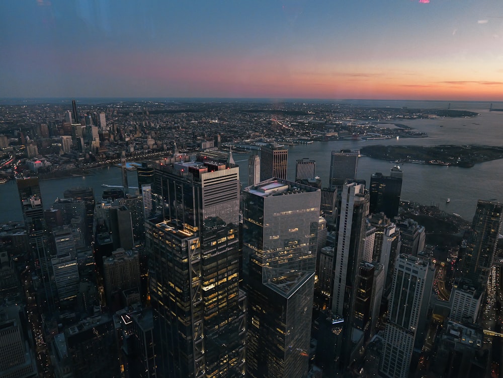 an aerial view of a city at dusk