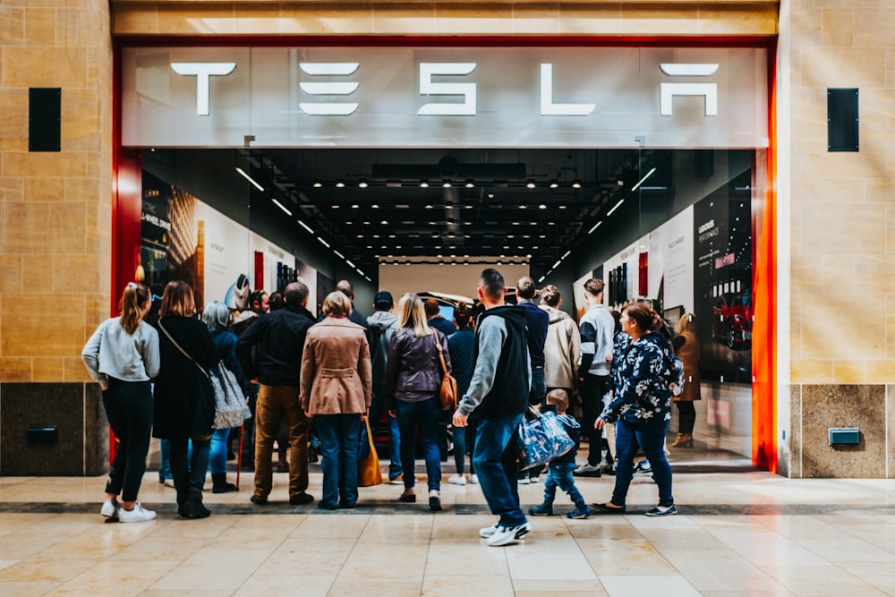 a group of people standing outside of a building