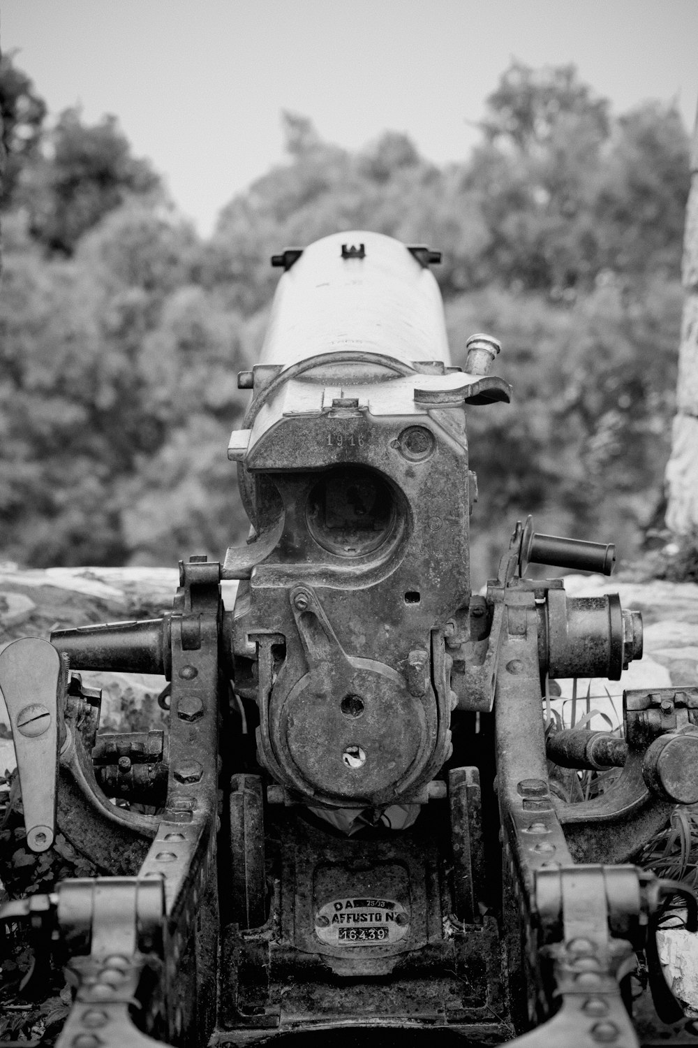 a black and white photo of an old engine