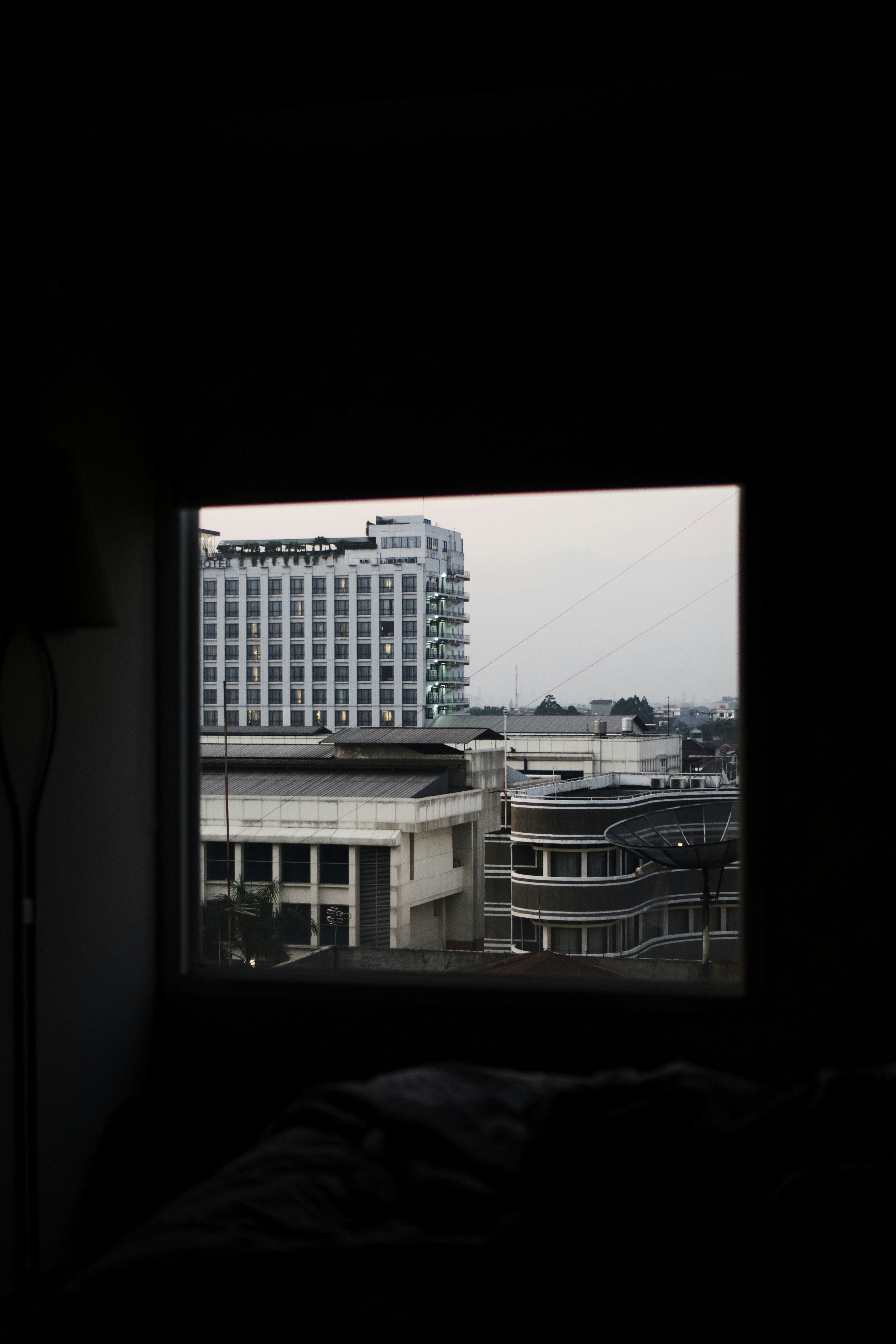 A view of a building through a window photo – Free Building Image on ...