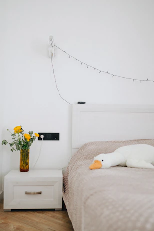 A cozy bedroom featuring high-quality sheets from Nido.