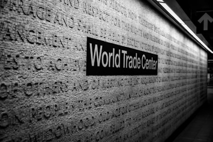 a black and white photo of a world trade center sign