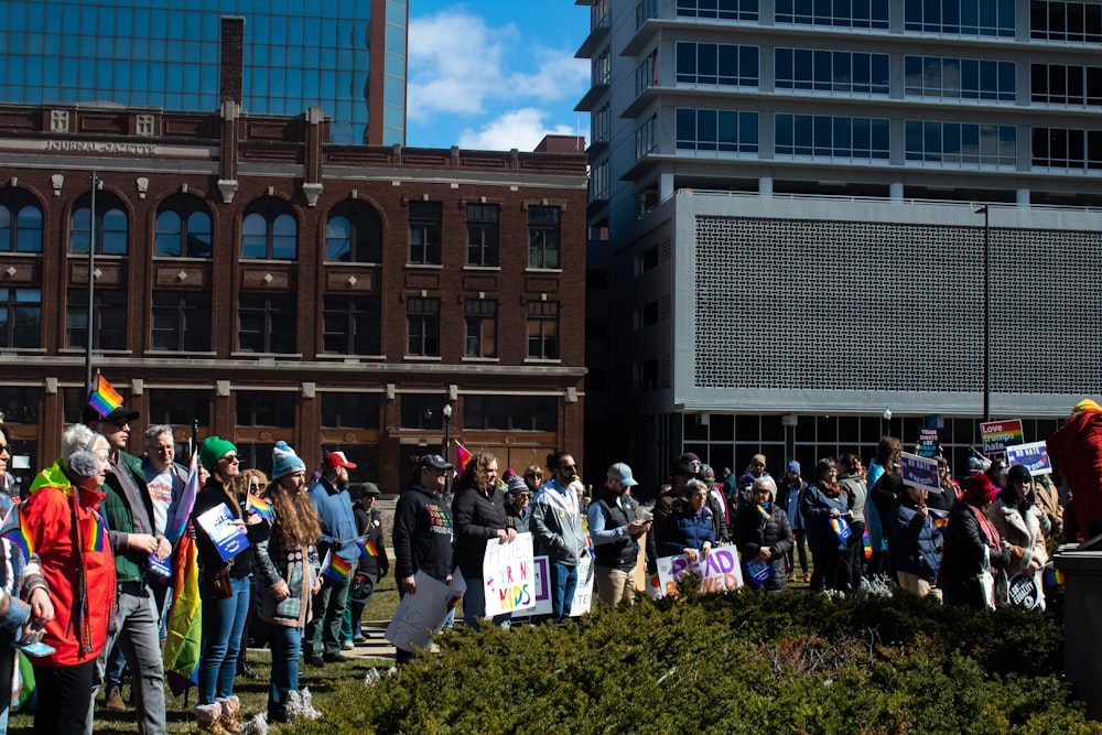 a large group of people standing in front of a building