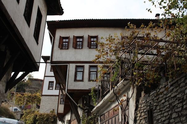 Traditional farmhouse architecture with wooden beams and stone walls in Nashik.