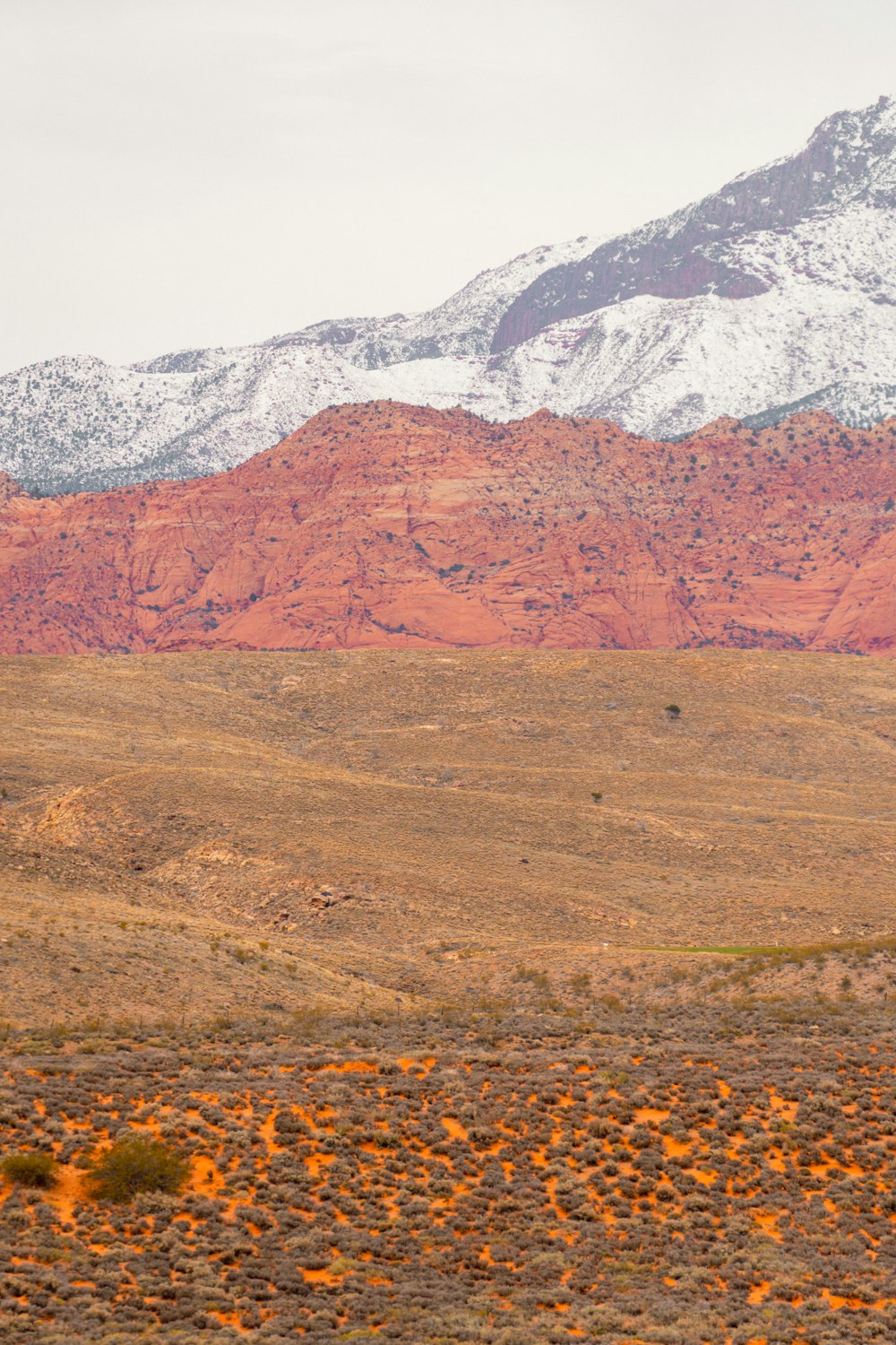 a mountain range with snow on the top of it