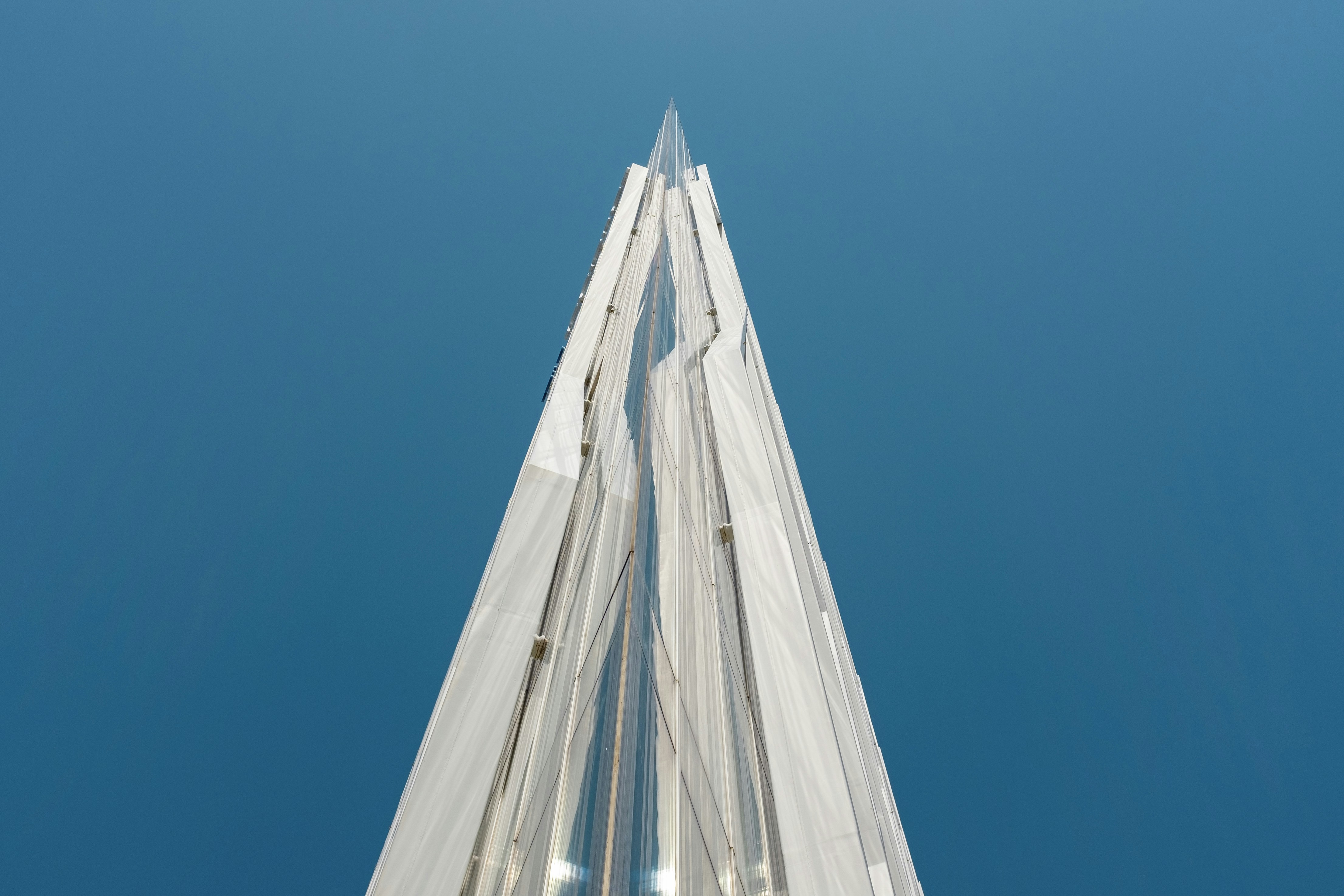 looking up at the top of a tall building