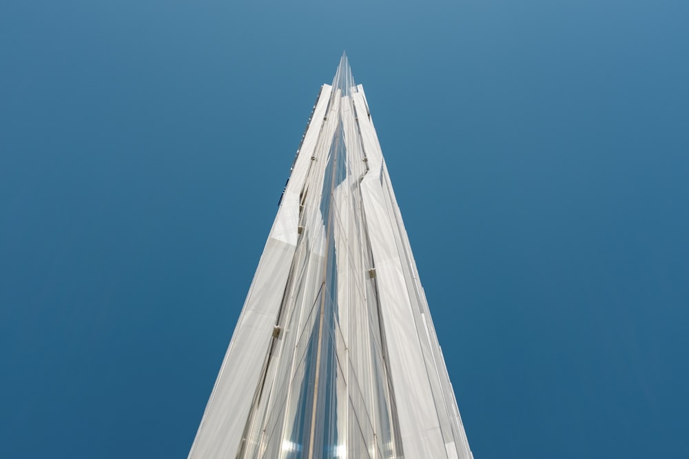 looking up at the top of a tall building