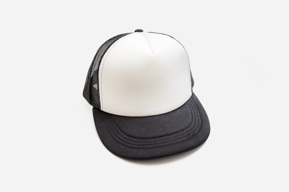 a black and white trucker hat on a white background