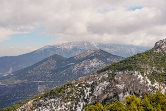 A scenic view of the Patagonia landscape showcasing mountains and greenery.