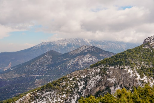 A scenic view of the Patagonia landscape showcasing mountains and greenery.