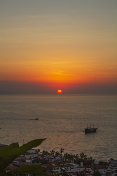 A vibrant sunset over a tropical beach, symbolizing travel adventures.