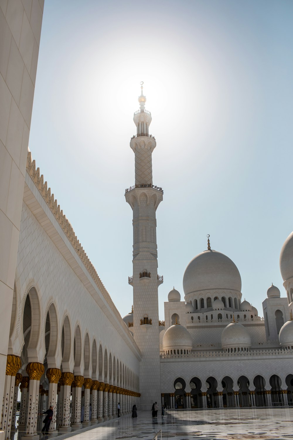 a large white building with a tall tower