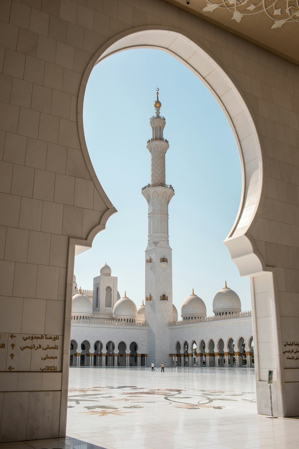 a large white building with a tall tower