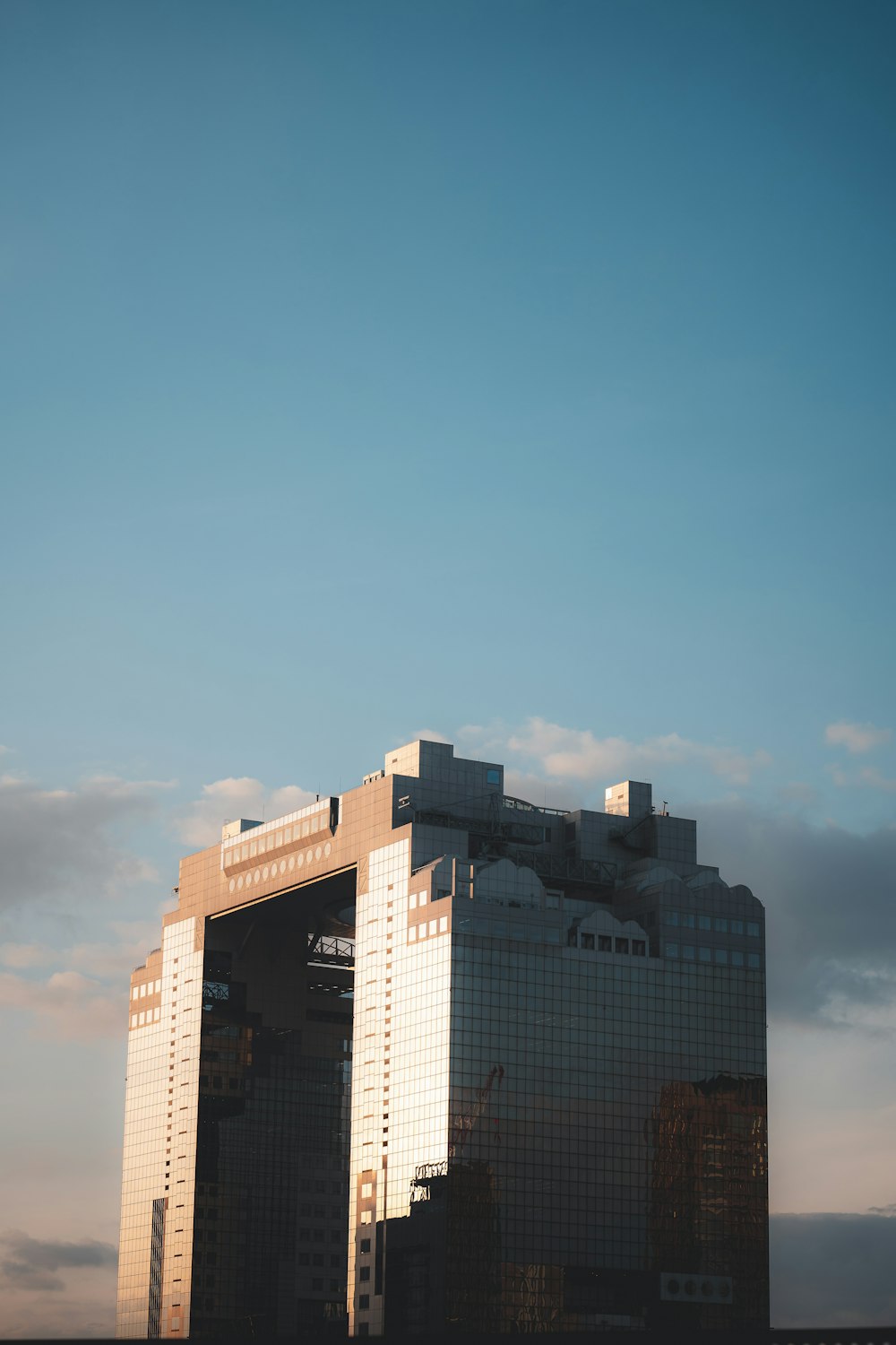 a very tall building with a sky in the background