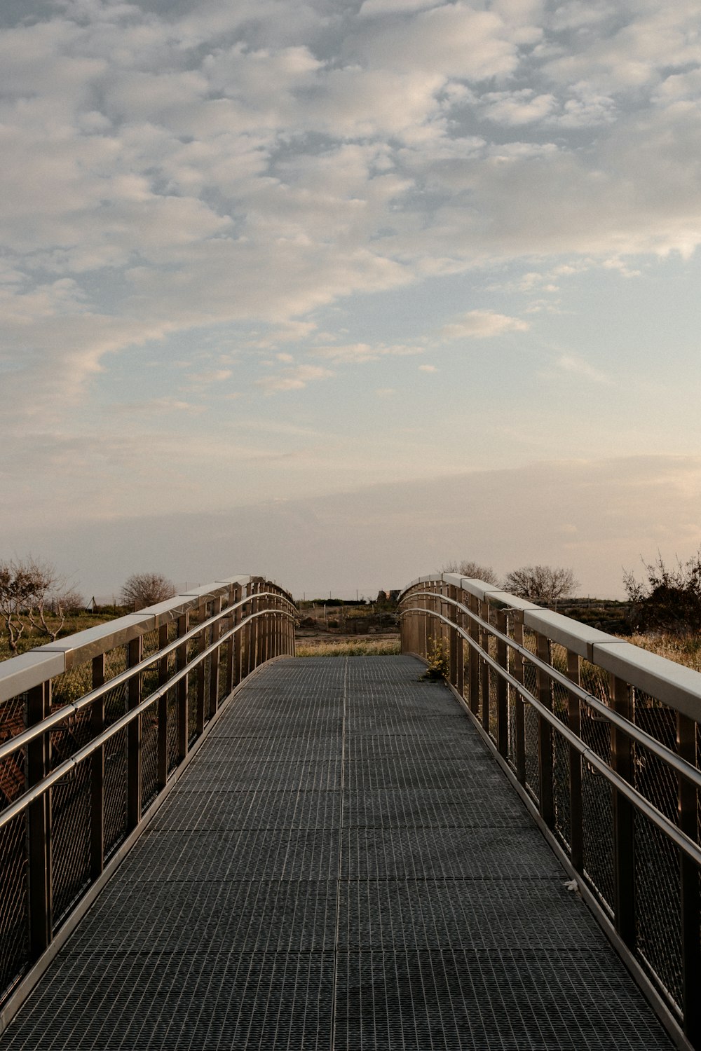 a bridge that has a metal railing on it