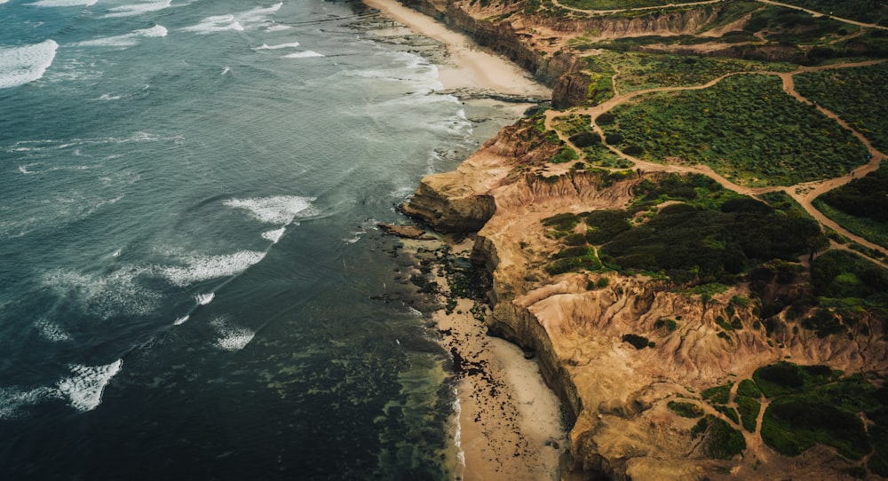 an aerial view of a beach and ocean