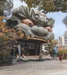 a building with a dragon head on the side of it