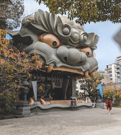 a building with a dragon head on the side of it