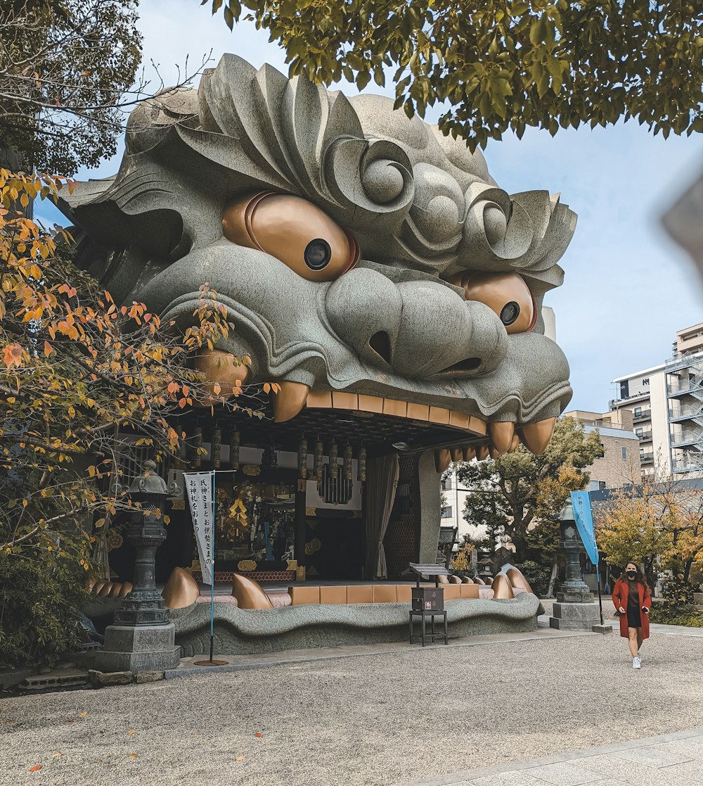 a building with a dragon head on the side of it