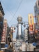 a city street filled with lots of tall buildings