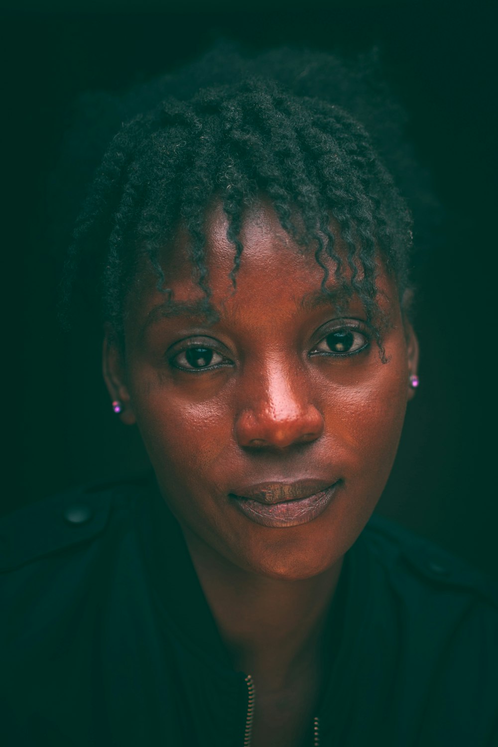 a close up of a person with dreadlocks