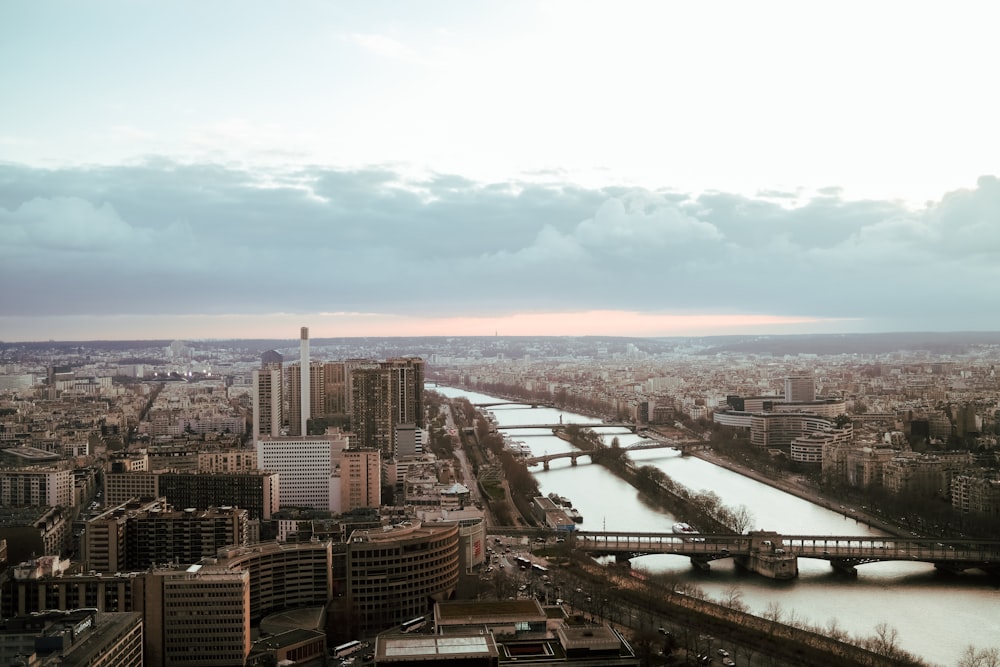 a river running through a city next to tall buildings