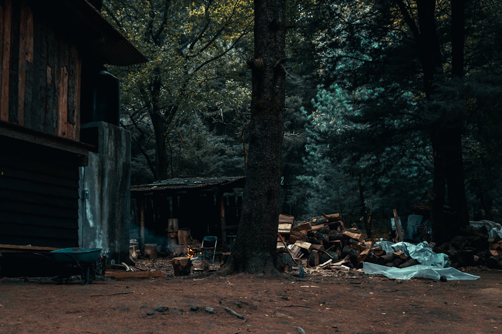 a pile of wood sitting in front of a building