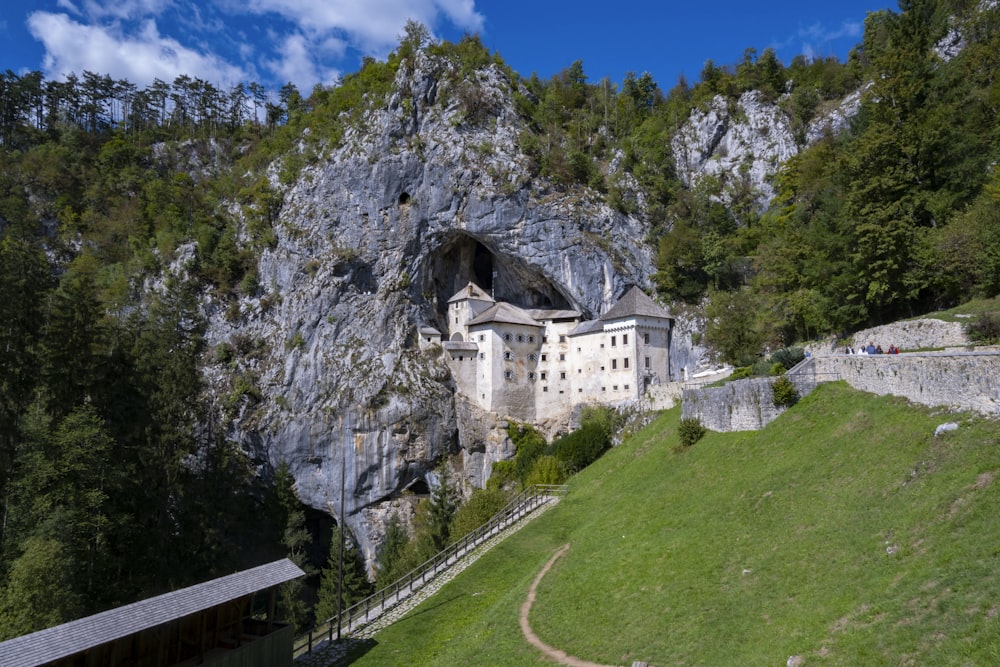 a castle built into the side of a mountain