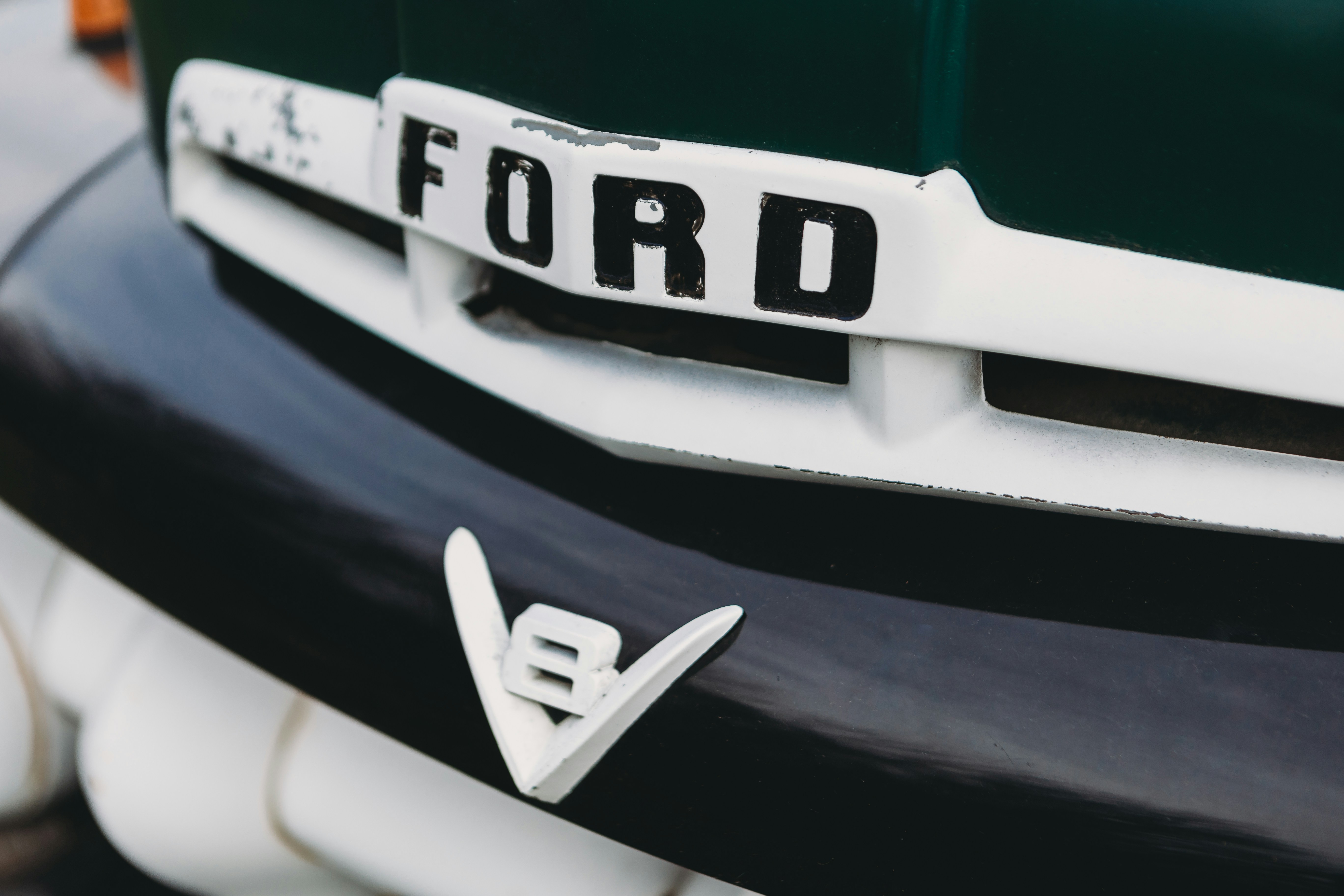 Ford Mustang Mach‑E electric SUV driving in an urban setting