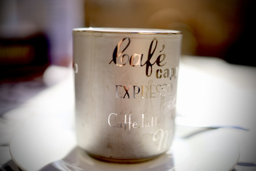 a coffee cup that is sitting on a plate