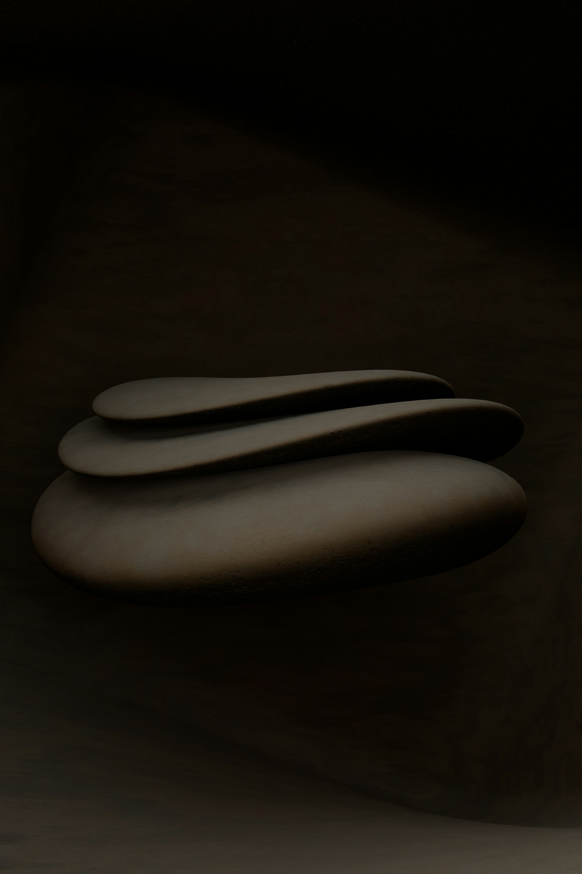 a black and white photo of three rocks