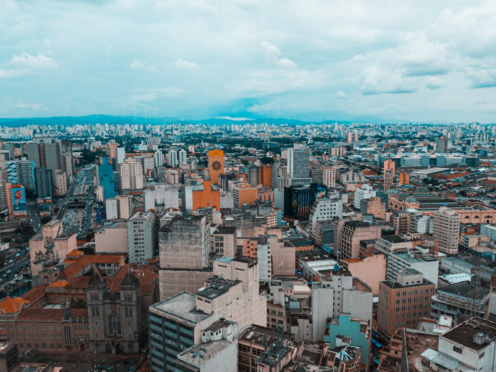 an aerial view of a city with tall buildings